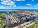 Aerial view showcasing the home's waterfront location and surrounding community at 12637 2Nd Isle, Hudson, FL 34667