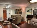 Living room with hardwood floors and access to kitchen at 21146 Fountain View Ln # 4102, Lutz, FL 33558