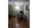 Home office space with a standing desk, comfortable chair, and large screen TV at 140 Callaway Ave, Spring Hill, FL 34606