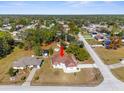 Aerial view showcasing a single-story house, its neighborhood, and surrounding landscape at 9172 Horizon Dr, Spring Hill, FL 34608