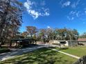 Property with multiple buildings, including a barn and mobile home at 3234 Ella Ln, New Port Richey, FL 34655