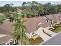 Aerial view of house and surrounding golf course community at 9609 Brookdale Dr, New Port Richey, FL 34655