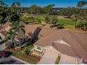 Aerial view of houses and golf course at 9609 Brookdale Dr, New Port Richey, FL 34655