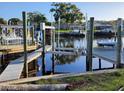 Private boat docks with multiple slips and waterfront access at 1050 Tamarac Dr, Holiday, FL 34690