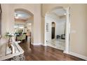 Bright and spacious entryway with hardwood floors and arches at 13455 Niti Dr, Hudson, FL 34669