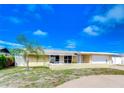 Single-story home with attached garage and landscaping at 13541 Stacey Dr, Hudson, FL 34667