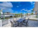 Outdoor patio with table and chairs overlooking the canal at 13541 Stacey Dr, Hudson, FL 34667