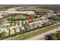 Aerial view showcasing the home's location within a residential neighborhood at 14120 Whitecap Ave, Hudson, FL 34667