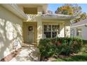 Front entrance with walkway, landscaping, and a decorative welcome sign at 14120 Whitecap Ave, Hudson, FL 34667