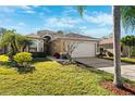 Beautiful single-Gathering home with well-manicured lawn and driveway at 4886 Westchester Ct, Oldsmar, FL 34677