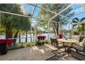 Enjoy the lake view from this screened patio with seating at 4886 Westchester Ct, Oldsmar, FL 34677