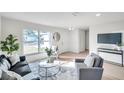 Bright living room with light flooring, comfy seating, and large windows at 101 Hillcrest Dr, Safety Harbor, FL 34695