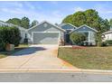 Single-Gathering home with a two-car garage and nicely landscaped lawn at 10169 Holly Berry Dr, Weeki Wachee, FL 34613