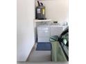 Interior laundry room with washer, dryer, and water heater at 13219 Greenview Ct, Hudson, FL 34669
