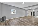 Bright living room with gray walls and wood-look floors at 21000 Nina Ln, Brooksville, FL 34601