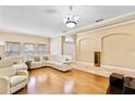 Spacious living room with hardwood floors and a large sectional sofa at 2902 Punta Palma Ct, Holiday, FL 34691