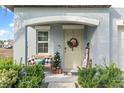 Inviting front porch with a bench and holiday decor at 313 Argyll Dr, Spring Hill, FL 34609