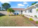 Landscaped front yard with a walkway leading to the house entrance at 3133 Covina St, New Port Richey, FL 34655