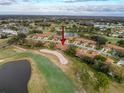 Aerial view showcasing home's location in a golf course community at 3417 Lori Ln # 2, New Port Richey, FL 34655