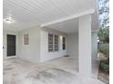 Covered front porch with access to carport and front door at 5931 Pine St, New Port Richey, FL 34652