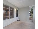 Covered front porch with access to front door and window at 5931 Pine St, New Port Richey, FL 34652