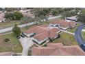 Aerial image showcasing a cluster of villas, ample parking, and surrounding landscape at 8350 High Point Cir # 3, Port Richey, FL 34668
