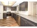 Renovated kitchen, granite countertops, stainless steel appliances at 9321 Mansard Ln, Port Richey, FL 34668
