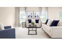 Spacious living room with beige walls, two sofas and a coffee table at 17104 6Th E Ter, Bradenton, FL 34212