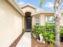Front entry with walkway and landscaping at 18732 Dobson Dr, Hudson, FL 34667