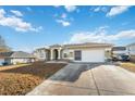 House exterior with a driveway, landscaping, and a motorhome parked nearby at 3110 Lema Dr, Spring Hill, FL 34609