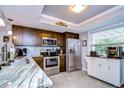 Modern kitchen featuring stainless steel appliances and granite countertops at 3920 Trophy Blvd # 6, New Port Richey, FL 34655