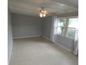 Living room featuring tile floors and neutral walls at 4011 W Mango Ave, Tampa, FL 33616