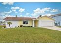 Newly renovated single-story house with a well-maintained lawn at 4270 Paradise Cir, Hernando Beach, FL 34607