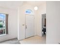 Bright entryway with view to dining area at 4380 Lamson Ave, Spring Hill, FL 34608