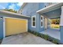 New home features a yellow two-car garage at 5742 Meadowlane St, New Port Richey, FL 34652