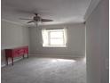 Living room with bay window and ceiling fan at 7129 Beachdale Ct, Port Richey, FL 34668