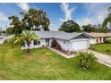 This single-story home has a large backyard and is situated on a quiet street at 8015 Pequena Dr, Port Richey, FL 34668