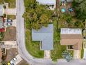 Home is located in a residential neighborhood with mature trees at 8015 Pequena Dr, Port Richey, FL 34668