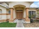 Elegant entryway with double doors, columns, and a welcoming atmosphere at 811 Laurelridge Ct, Brooksville, FL 34601