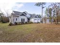 Two-story house on a large lot with mature trees at 18025 Nimick Rd, Weeki Wachee, FL 34614