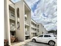 Condo building with parking and landscaping at 2625 State Road 590 # 1233, Clearwater, FL 33759