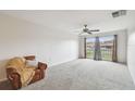 Bright bedroom with large window and ceiling fan at 2700 Bayshore Blvd # 3108, Dunedin, FL 34698