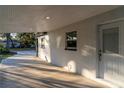 Covered patio with access to backyard and additional parking at 405 Pine S Ave, Oldsmar, FL 34677