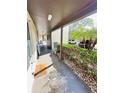 Covered walkway leading to condo units with landscaping at 4515 Marine Pkwy # 102, New Port Richey, FL 34652