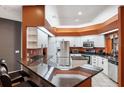 Modern kitchen with granite countertops and stainless steel appliances at 9105 Flagstick Ln, Hudson, FL 34667