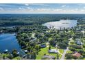 Aerial view of a house near Lake Ann with access to the lake at 1523 Fishing Lake Dr, Odessa, FL 33556