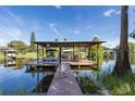 Private covered boat dock on the lake at 1523 Fishing Lake Dr, Odessa, FL 33556