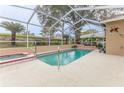 Relaxing pool and spa area with screened enclosure at 2217 Terrace View Ln, Spring Hill, FL 34606