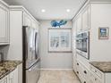 Modern kitchen with stainless steel appliances and ample cabinet space at 3259 Hilary Cir # 1C, Palm Harbor, FL 34684