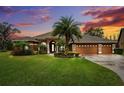 Home with three-car garage at sunset at 3414 Graycliff Ln, Brandon, FL 33511
